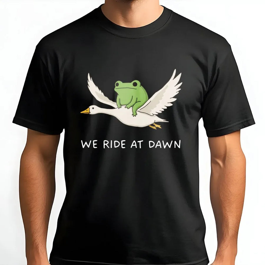 We Ride at Dawn T-Shirt | Funny Frog Riding Goose Graphic | Premium Cotton Blend | Unisex Gamer & Meme Lover Gift