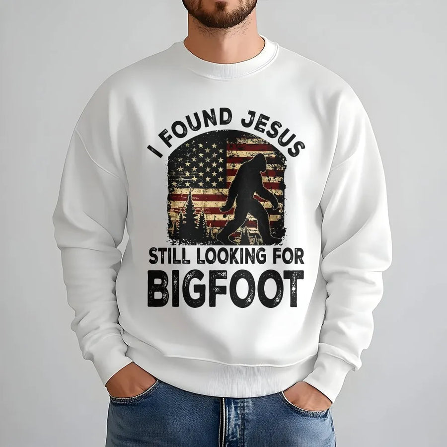 Funny Bigfoot Sweatshirt | I Found Jesus Sasquatch Graphic with Retro American Flag | Premium Cotton Tee | Gift for Christian Humor & Hunters