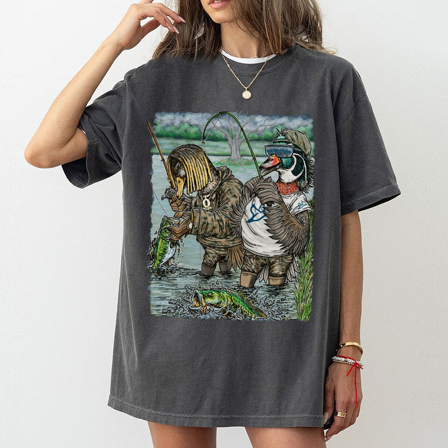 Fishing Duck Graphic T-Shirt | Funny Bass Fisherman Cartoon Design | Premium 100% Cotton Apparel | Unique Gift for Outdoorsmen & Country Boys