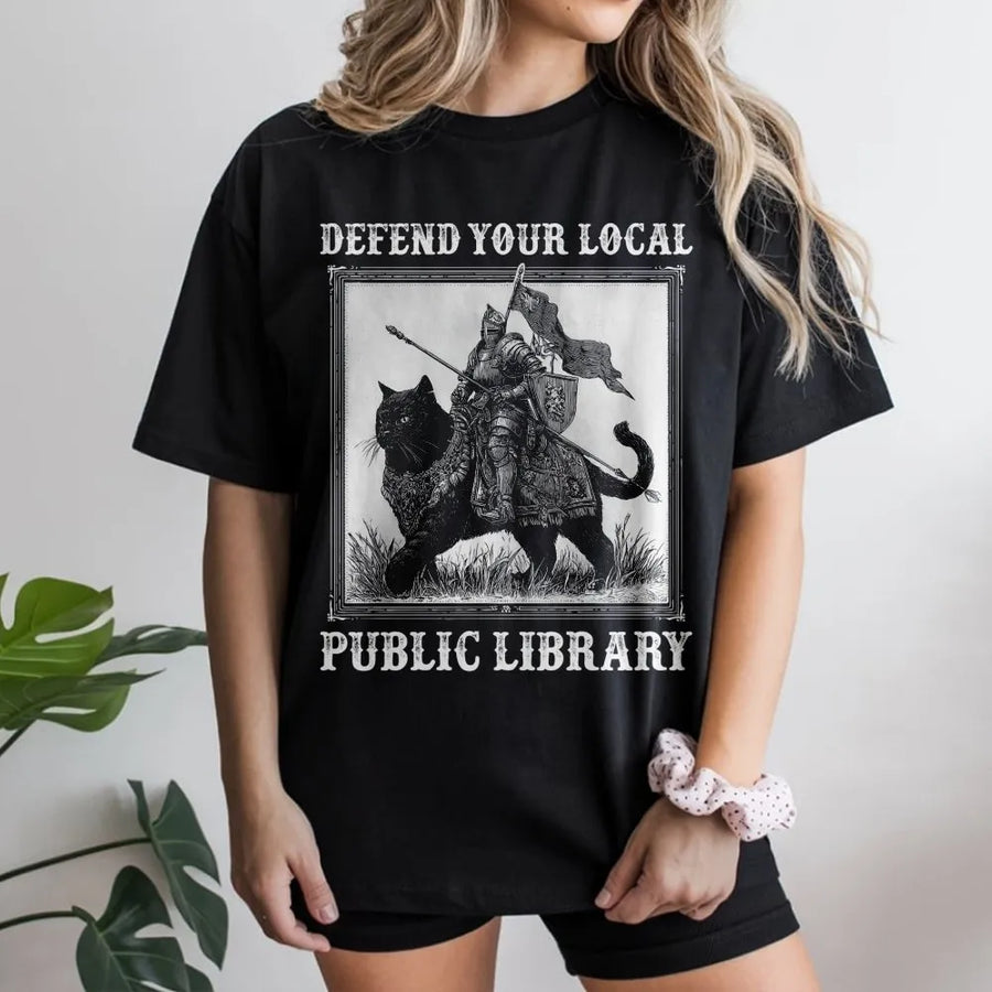 Defend Your Local Public Library T-Shirt | Medieval Knight Riding Black Cat Graphic | Premium 100% Cotton | Funny Book Lover Gift for Readers