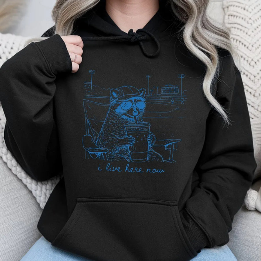 Funny Raccoon Baseball Hoodie | 'I Live Here Now' Graphic Sweatshirt | Premium Soft Blend | Humorous Gift for Sports Moms and Parents