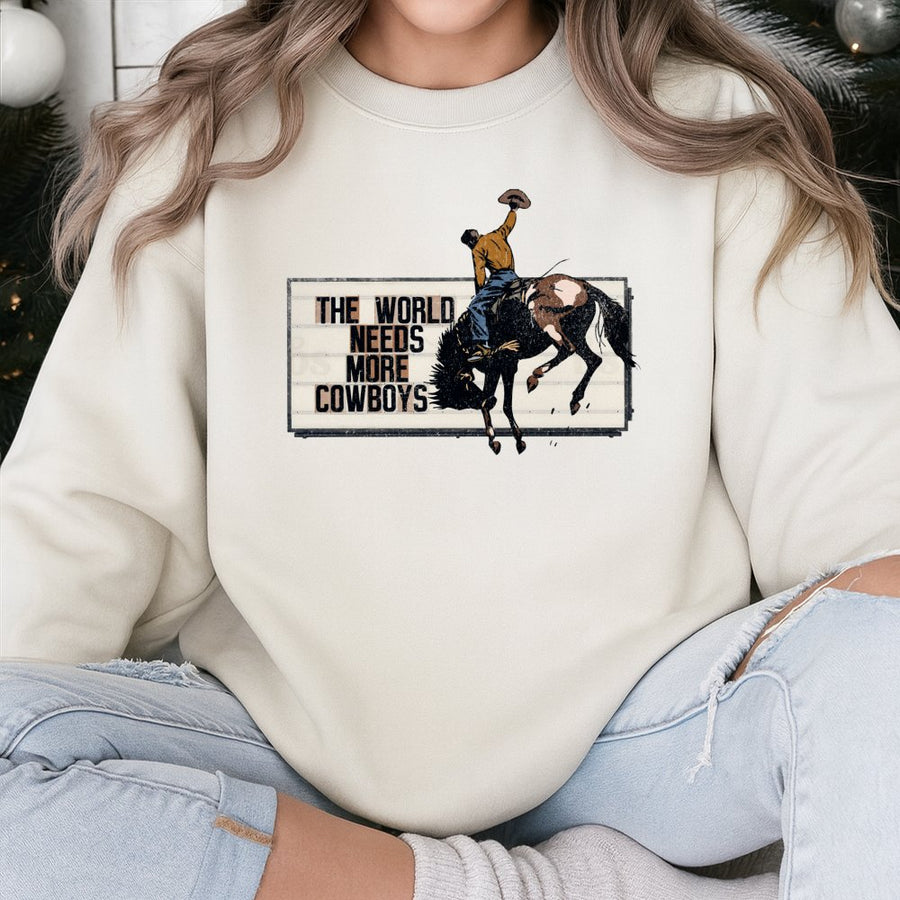 The World Needs More Cowboys Sweatshirt | Vintage Rodeo Graphic Western Print | Cotton Blend Crewneck | Unisex Country Western Gift for Cowgirl