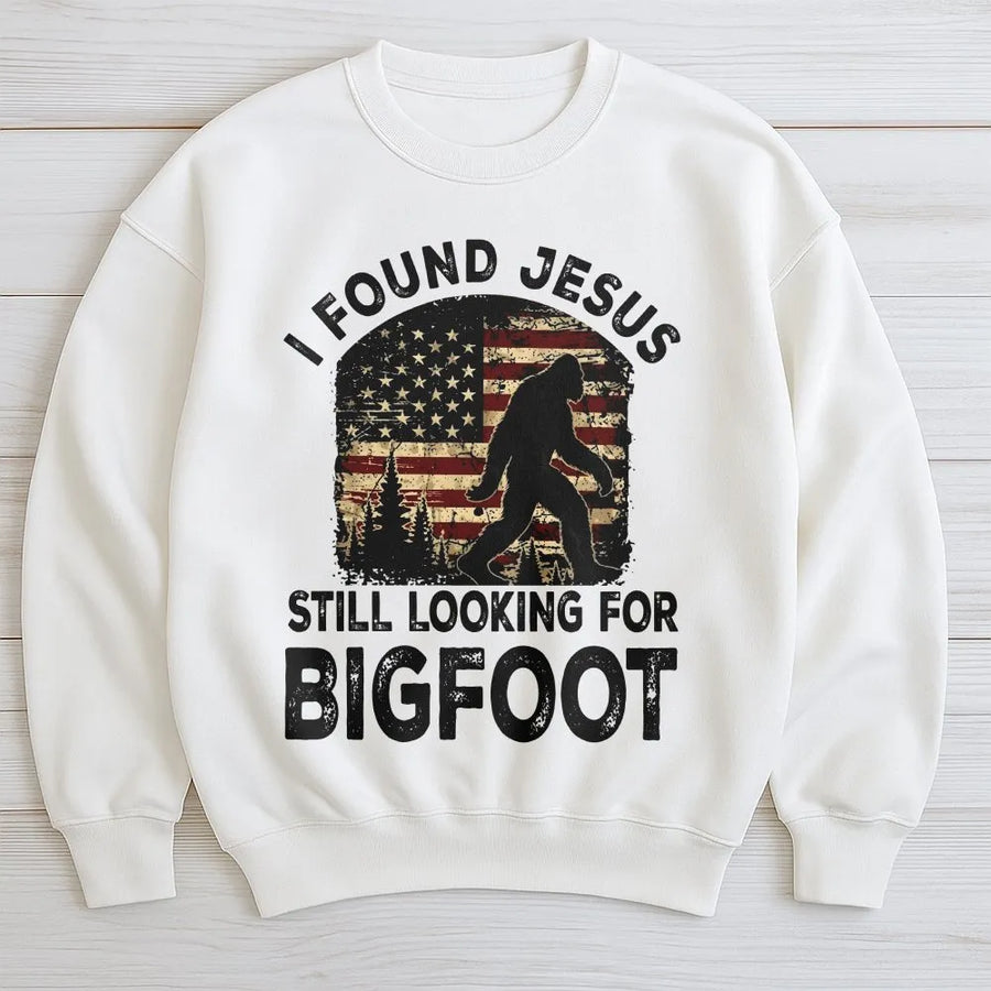 Funny Bigfoot Sweatshirt | I Found Jesus Sasquatch Graphic with Retro American Flag | Premium Cotton Tee | Gift for Christian Humor & Hunters