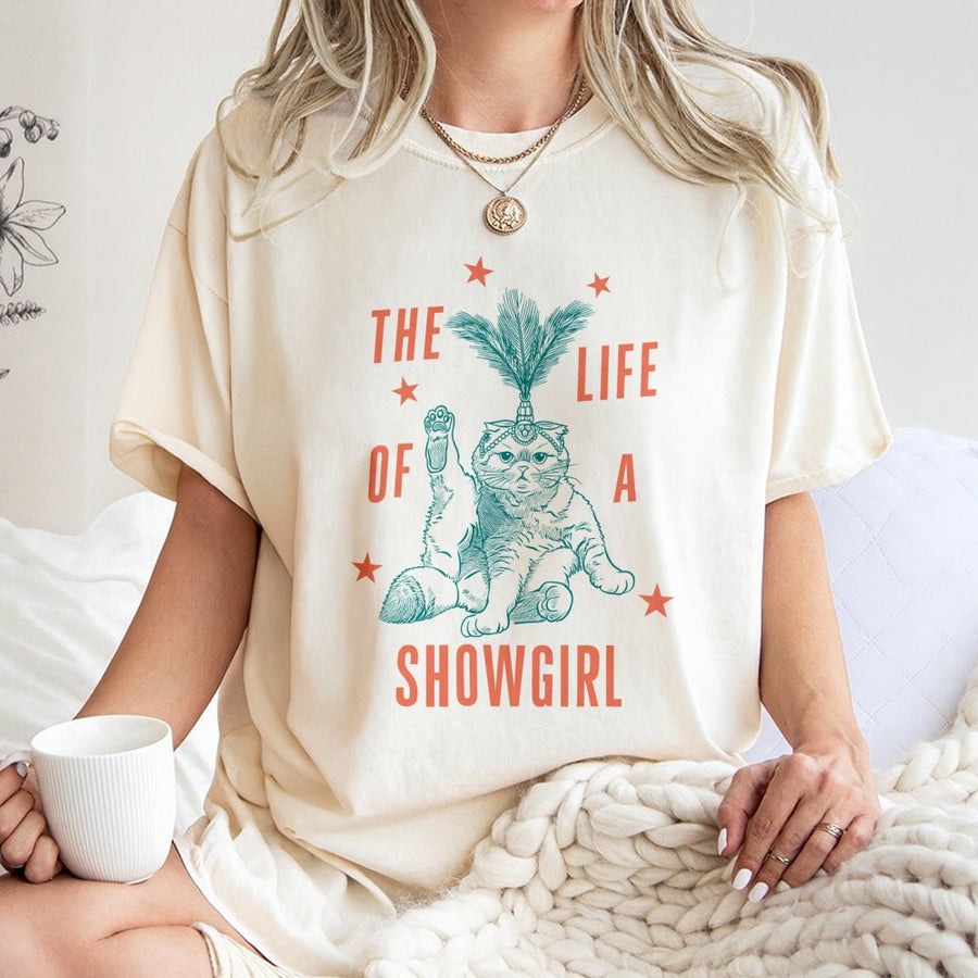Showgirl Cat T-Shirt | Funny Feather Headdress Kitten Graphic | Premium Cotton Unisex Tee | Gift for Cat Lovers & Broadway Fans