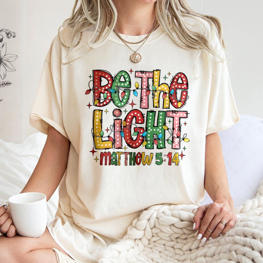 Be The Light T-Shirt | Matthew 5:14 Christmas Bible Verse Graphic | 100% Cotton Premium Tee | Christian Religious Gift for Women and Men