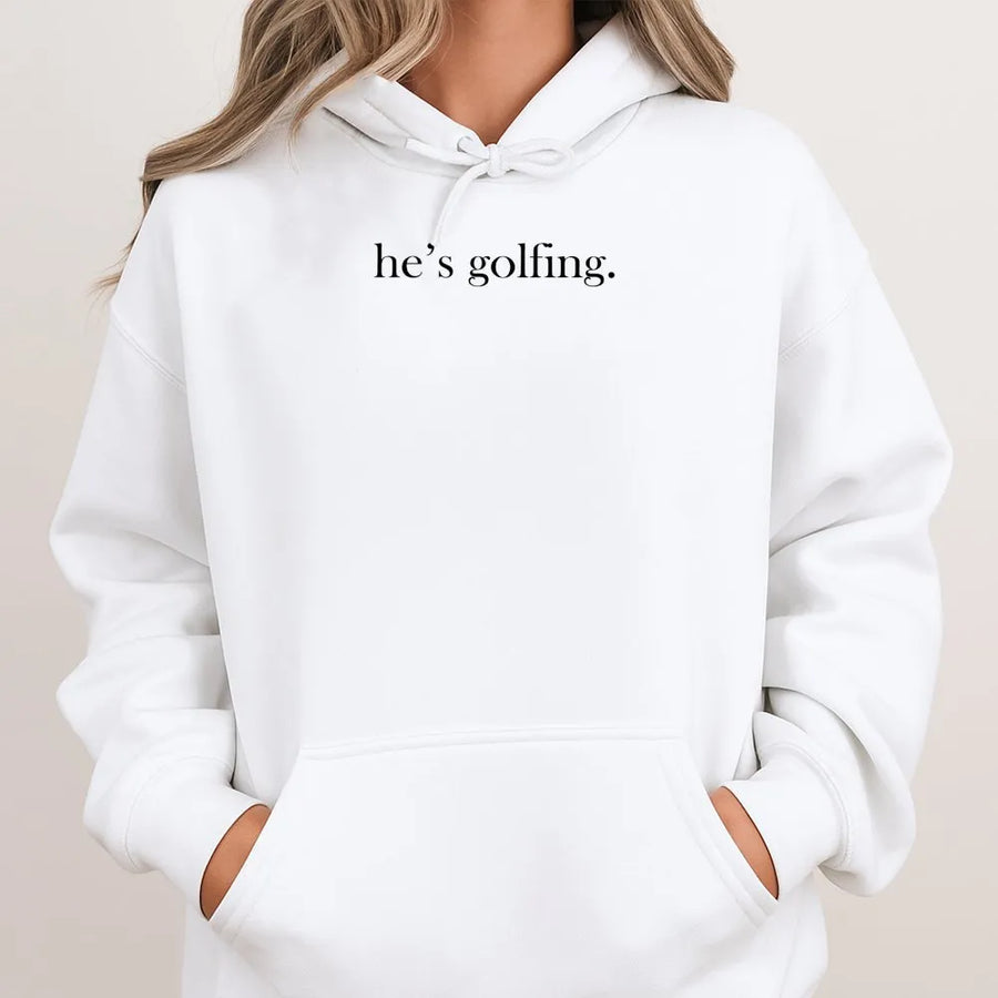 He's Golfing Hoodie | Minimalist Funny Golf Typography | Premium Soft Cotton Blend | Gift For Golfer Boyfriend Husband Dad