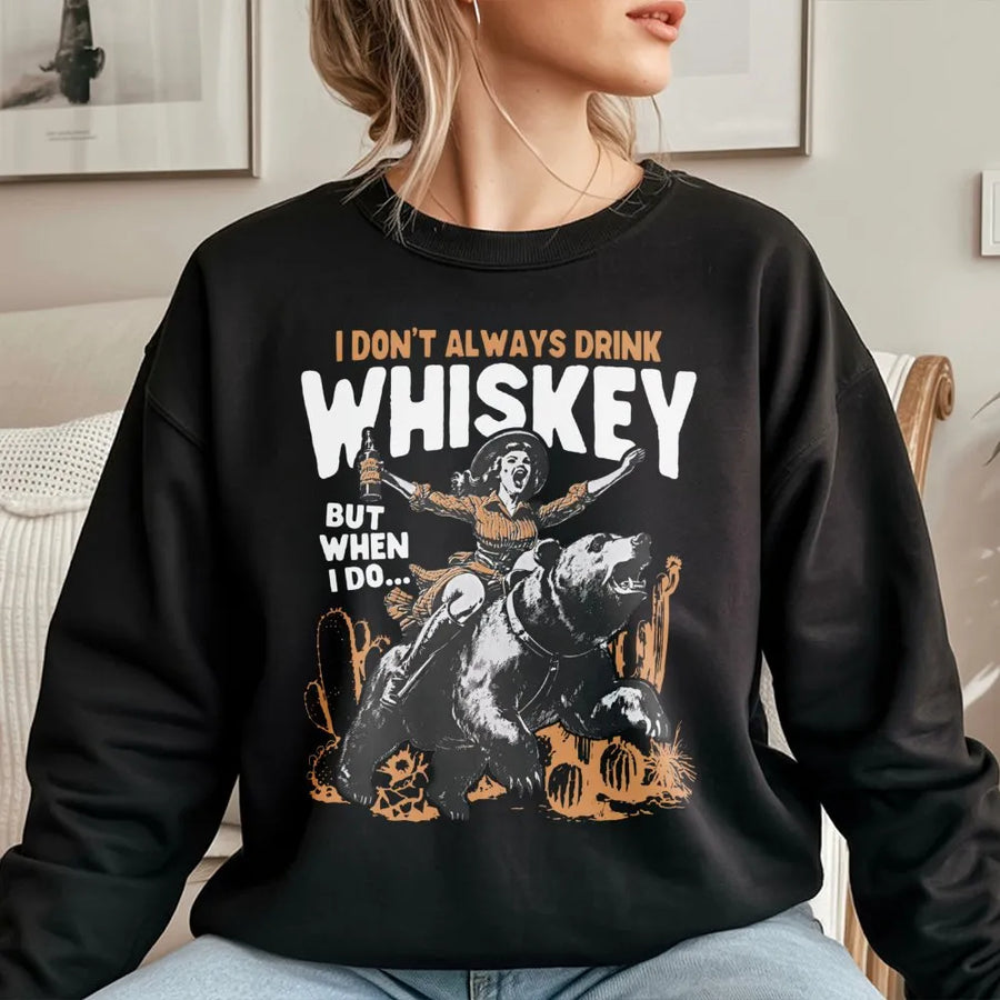 Whiskey Drinking Graphic Sweatshirt | Cowboy Girl Riding Bear Western Design | Premium Cotton Blend | Funny Gift for Whiskey Lovers and Men Women