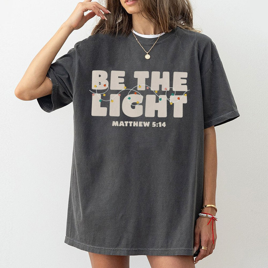Be The Light Christian T-Shirt | Matthew 5:14 Bible Verse Graphic | 100% Cotton Soft Apparel | Faith-Based Religious Christmas Gift For Men And Women