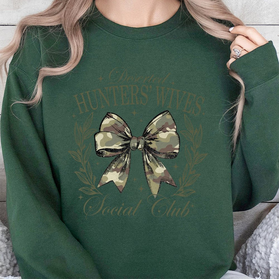 Deserted Hunters Wives Sweatshirt | Camo Bow Graphic Design | Premium Cotton-Poly Blend | Cozy Hunting Season Gift for Her