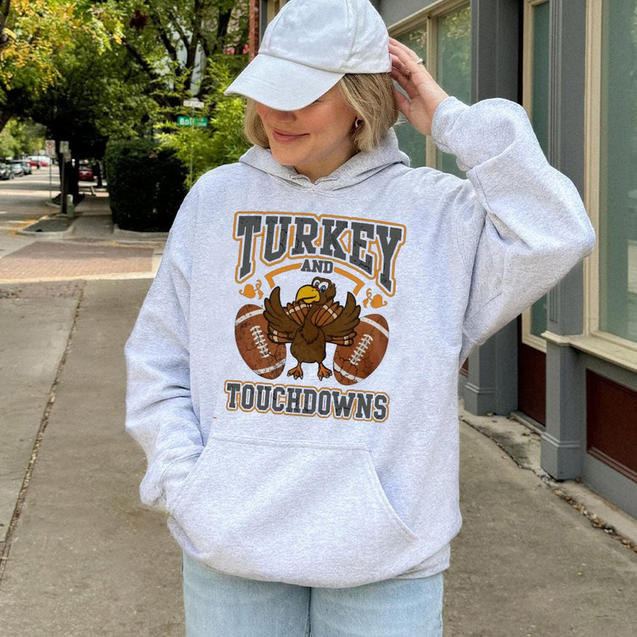 Turkey And Touchdowns Hoodie | Funny Thanksgiving Football Graphic | Premium Cotton Blend | Unisex Holiday Gift for Football Fans