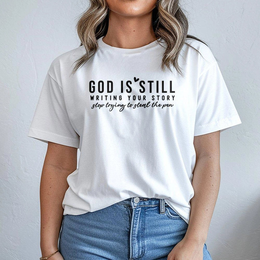 God Is Still Writing Your Story T-Shirt | Minimalist Christian Graphic Tee | Premium 100% Cotton | Faith-Based Inspirational Gift for Women and Men