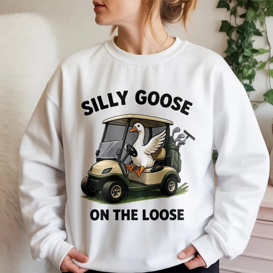 Silly Goose on the Loose Sweatshirt | Funny Goose Driving Golf Cart Graphic | Soft Cotton Blend | Unique Gift for Golfer