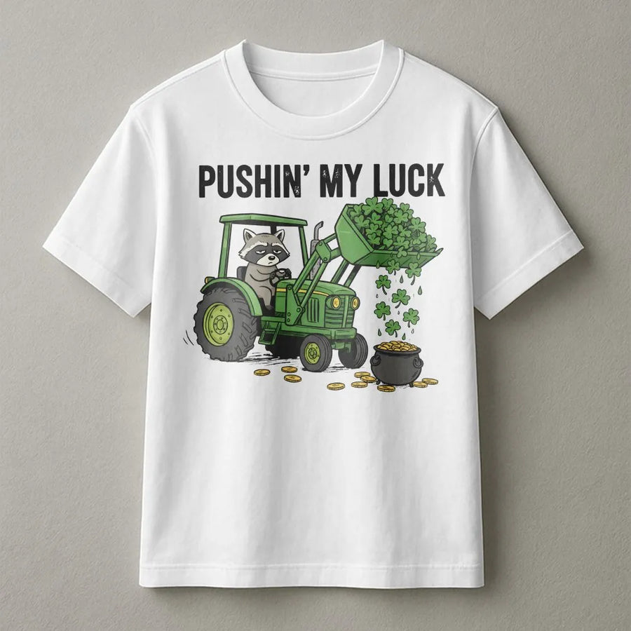 St Patrick’s Day Raccoon T-Shirt | Funny Tractor Clover Graphic | Premium 100% Cotton Tee | Gift for Farmers and Animal Lovers