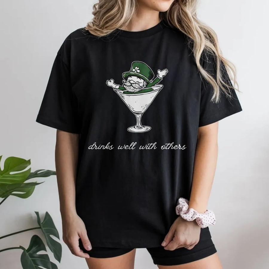 St Patrick's Day T-Shirt | Leprechaun in Martini Glass Graphic | 100% Cotton Premium Tee | Funny Drinks Well With Others Gift for Men Women
