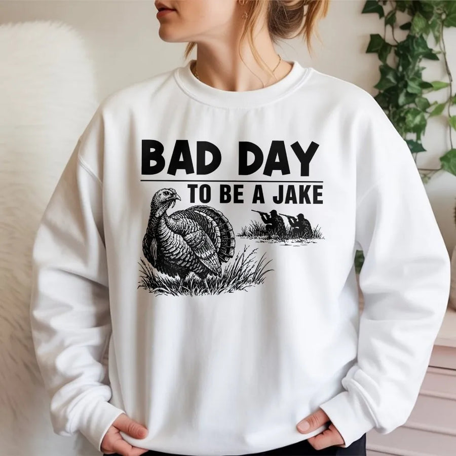 Bad Day To Be A Jake Sweatshirt | Funny Turkey Hunter Graphic Quote | Premium Cotton-Blend Sweatshirt | Unisex Gift for Hunter