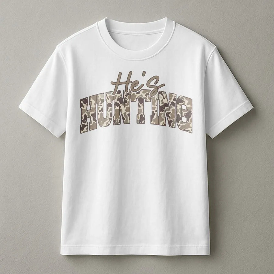 He's Hunting T-Shirt | Camo Varsity Lettering | Premium Cotton Graphic Tee | Funny Outdoorsman Gift for Hunters