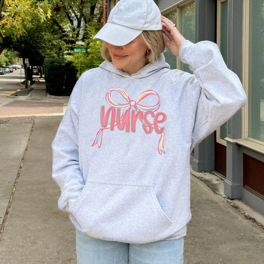 Nurse Coquette Hoodie | Aesthetic Pink Bow Graphic | Cotton-Blend Premium Comfort | Nursing Student & RN Graduation Gift