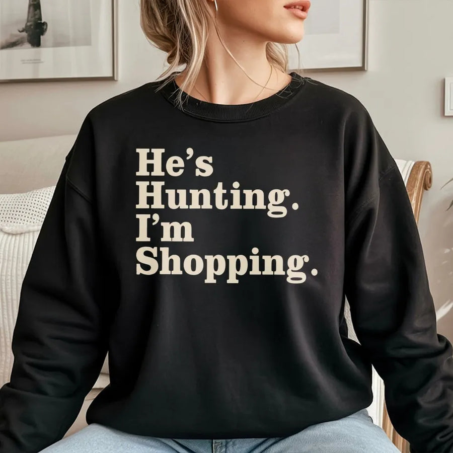 He's Hunting I'm Shopping Sweatshirt | Funny Country Wife Graphic | Soft Cotton Blend Premium Fleece | Cute Gift for Hunter Girlfriend