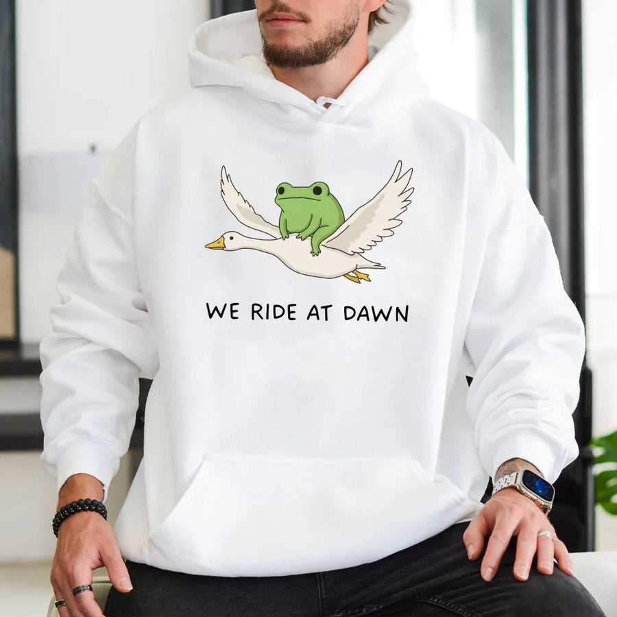 We Ride at Dawn Hoodie | Funny Frog Riding Goose Graphic | Premium Cotton Blend | Unisex Gamer & Meme Lover Gift