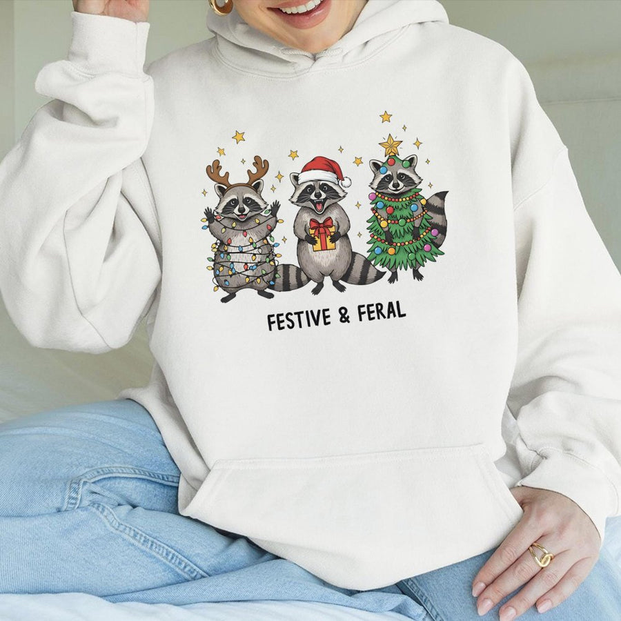 Festive and Feral Raccoon Hoodie | Funny Christmas Animal Graphic | Premium Cotton Blend Unisex Sweatshirt | Cute Holiday Gift for Wildlife Lovers