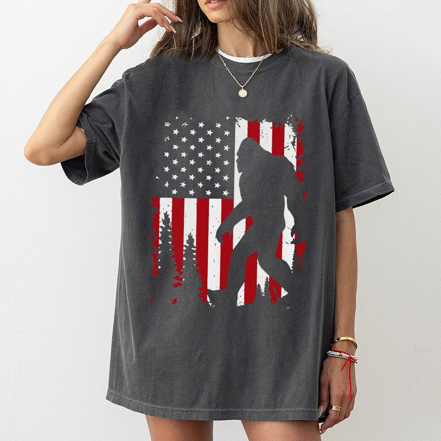 Bigfoot American Flag T-Shirt | Patriotic Sasquatch Forest Graphic | 100% Cotton Premium Tee | Unique Gift for Outdoor Lovers and Cryptozoology Fans