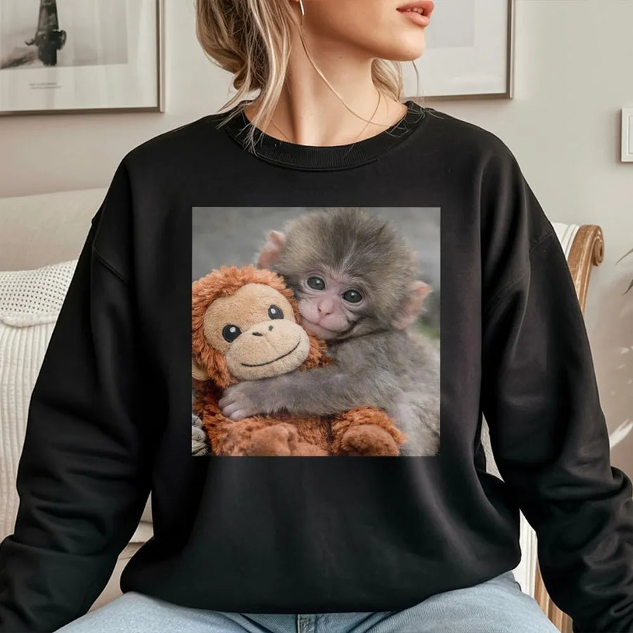 Baby Monkey Sweatshirt | Cute Monkey Hugging Plushie Graphic | Cozy Cotton-Blend Sweatshirt | Premium Gift for Animal Lovers