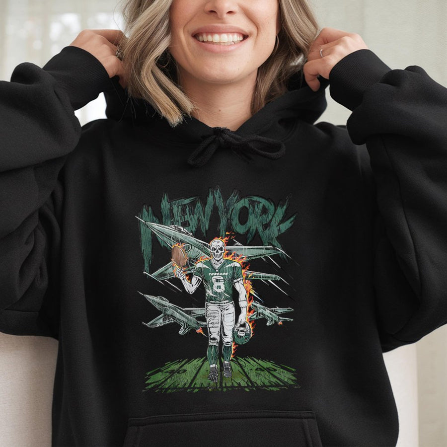 New York With A Skeleton Football Player Wearing Jersey Number 8, Holding A Football And Helmet, With Fighter Jets In The Background Hoodie