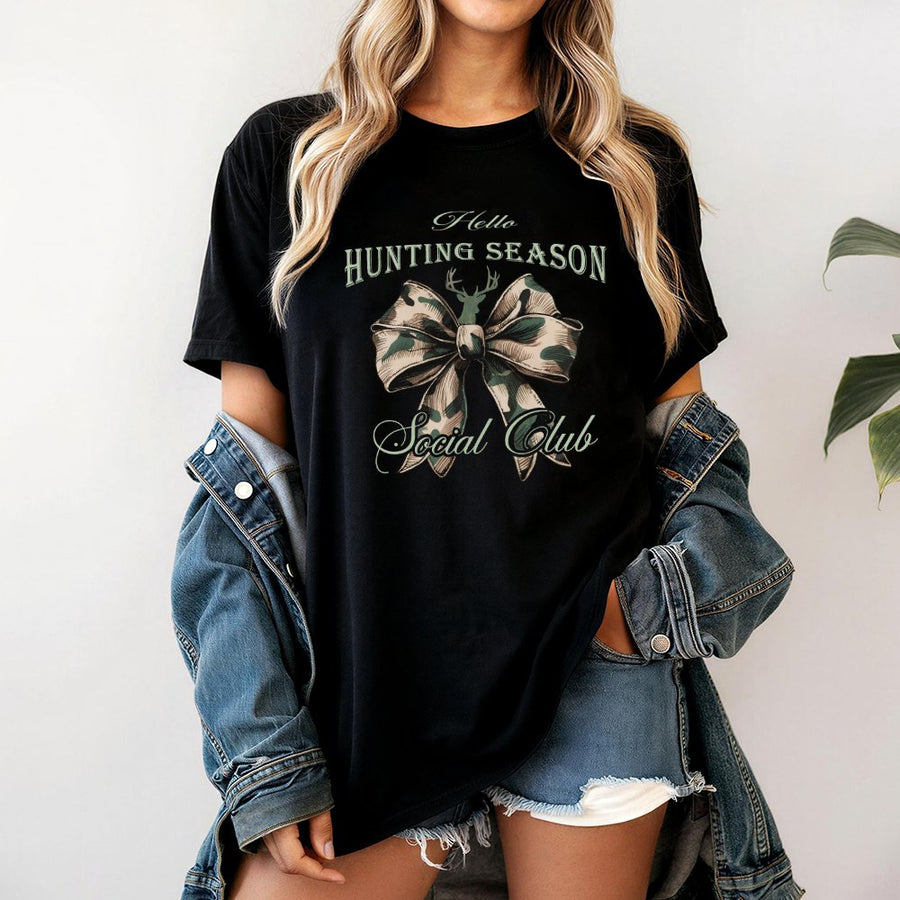 Hello Hunting Season T-Shirt | Camo Coquette Bow Graphic | 100% Cotton Premium Tee | Trendy Outdoors Aesthetic Gift for Women