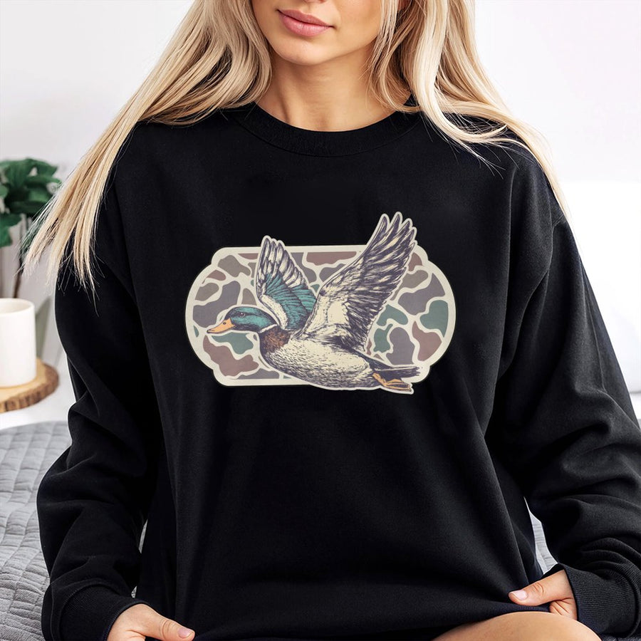 Flying Mallard Duck Sweatshirt | Vintage Camo Bird Graphic | Premium Cotton Blend Crewneck | Hunting Season Gift for Outdoorsman and Duck Hunter