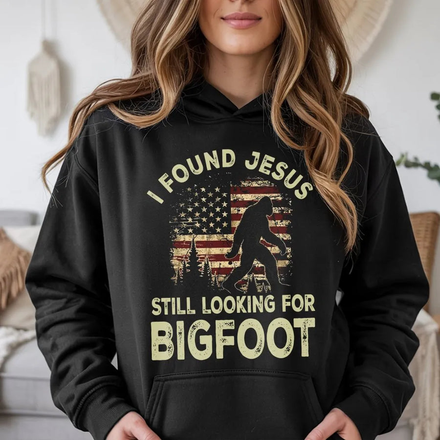 Funny Bigfoot Hoodie | I Found Jesus Sasquatch Graphic with Retro American Flag | Premium Cotton Tee | Gift for Christian Humor & Hunters