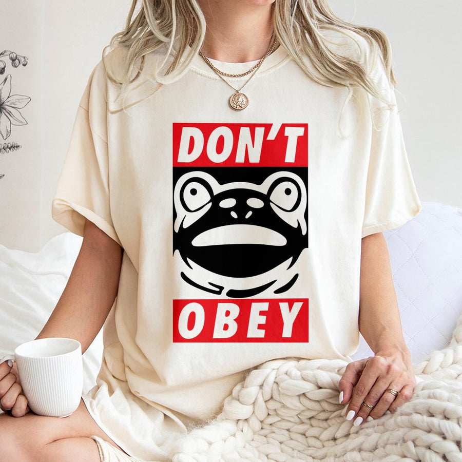 Dont Obey Frog Graphic T-Shirt | Funny Toad Resistance Art | Premium Cotton Unisex Tee | Retro Streetwear Aesthetic Gift for Men and Women