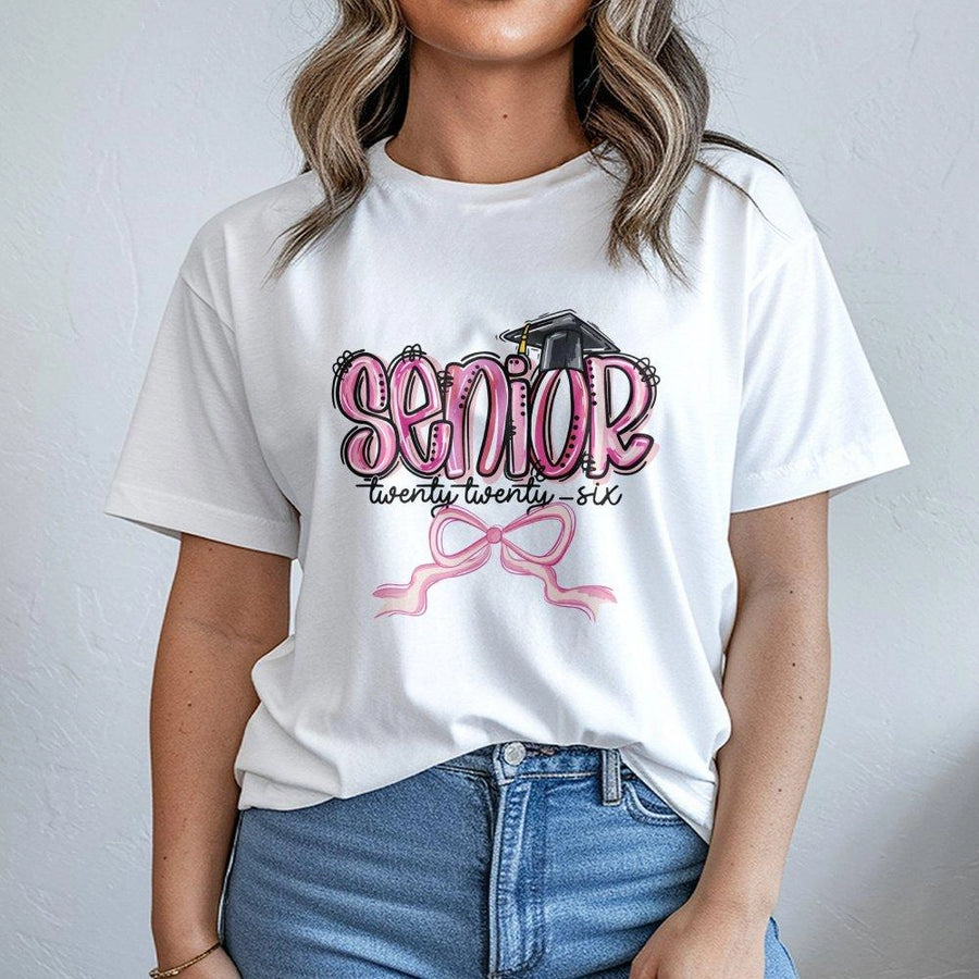 Senior 2026 T-Shirt | Pink Bow Graduation Cap Graphic Tee | Premium Cotton Casual Wear | Cute Gift for High School and College Senior Students