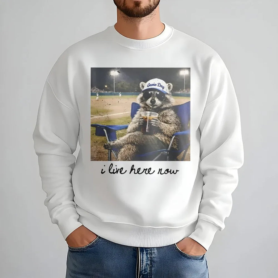 I Live Here Now Raccoon Shirt | Funny Travel Ball Parent Life Meme | Soft 100% Cotton Tee | Gift for Baseball Mom or Softball Dad