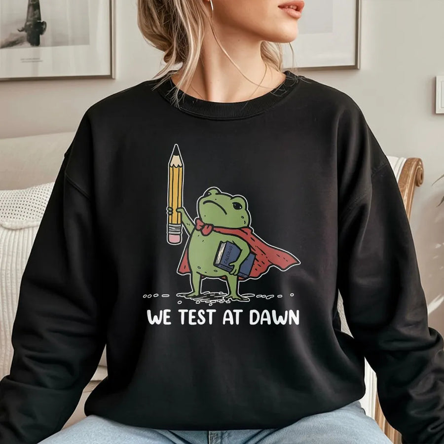 Funny Teacher Sweatshirt | We Test at Dawn Superhero Frog Graphic | Soft Cotton Blend Pullover | Gift for Educators and Professors