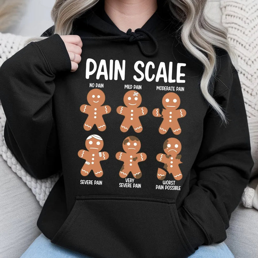 Pain Scale Gingerbread Man Hoodie | Funny Christmas Cookie Graphic | Premium Cotton Blend Unisex Sweatshirt | Unique Gift for Nurses and Doctors