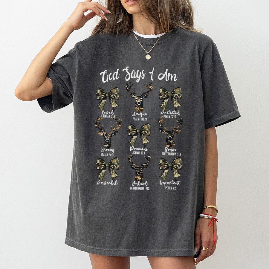 God Says I Am Bible Verse T-Shirt | Camo Deer and Coquette Bow Graphic | Premium 100% Cotton | Christian Hunting Gift for Women and Teens
