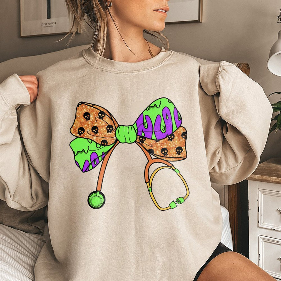 Spooky Nurse Sweatshirt | Halloween Stethoscope Coquette Bow Graphic | Premium Cotton Blend | Funny Nursing Student Gift for Halloween Season