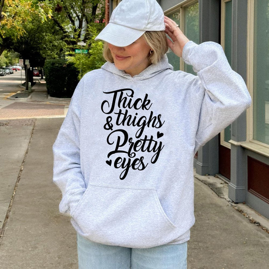 Thick Thighs Pretty Eyes Hoodie | Sassy Typography Graphic Sweatshirt | Premium Cotton-Poly Blend | Comfortable Casual Gift For Women