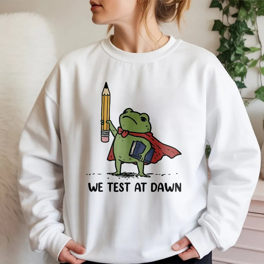 Funny Teacher Sweatshirt | We Test at Dawn Superhero Frog Graphic | Soft Cotton Blend Pullover | Gift for Educators and Professors