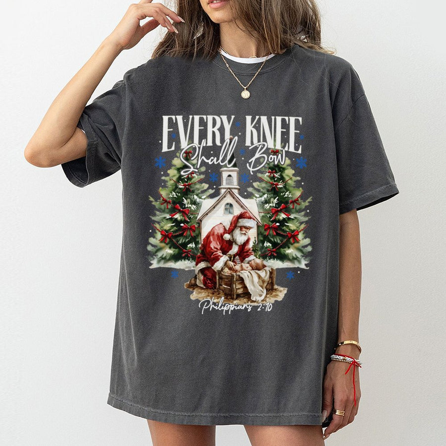 Every Knee Shall Bow T-Shirt | Santa Kneeling Before Baby Jesus | 100% Cotton Religious Christmas Graphic Tee | Meaningful Faith-Based Holiday Gift