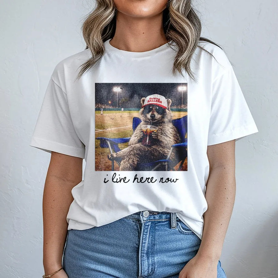 Funny Raccoon Baseball Mom T-Shirt | I Live Here Now Vintage Ballpark Graphic | Premium Cotton Blend | Gift for Softball Mama