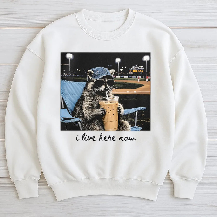 Funny Raccoon Baseball Sweatshirt | 'I Live Here Now' Graphic Tee | Soft Cotton Unisex Tee | Gift for Baseball Mom or Softball Dad Tournament Fan
