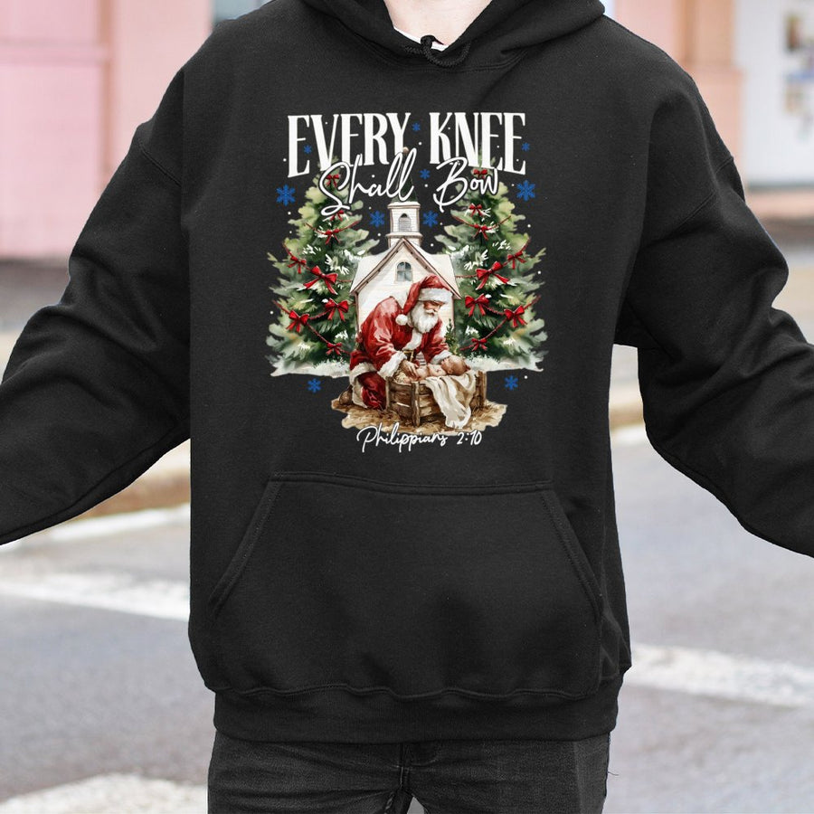 Every Knee Shall Bow Hoodie | Santa Kneeling Before Baby Jesus Religious Christmas Graphic | Premium Cotton Blend | Christian Holiday Gift for Believers