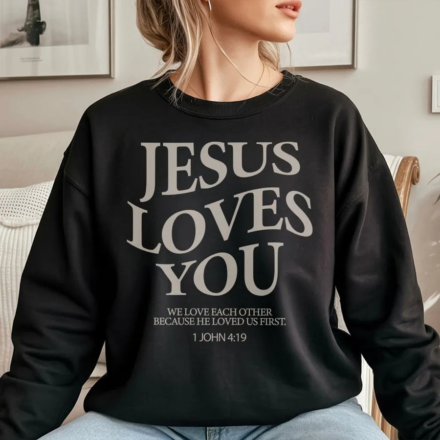 Jesus Loves You Sweatshirt | 1 John 4:19 Bible Verse Graphic | Premium Cotton Blend Crewneck | Christian Faith Gift for Women & Men