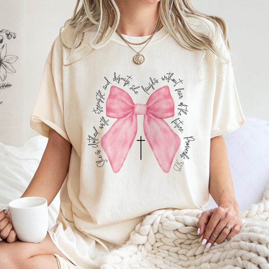Proverbs 31:25 Bible Verse T-Shirt | Pink Bow Coquette Aesthetic Graphic | Premium 100% Cotton Tee | Christian Faith Gift for Women