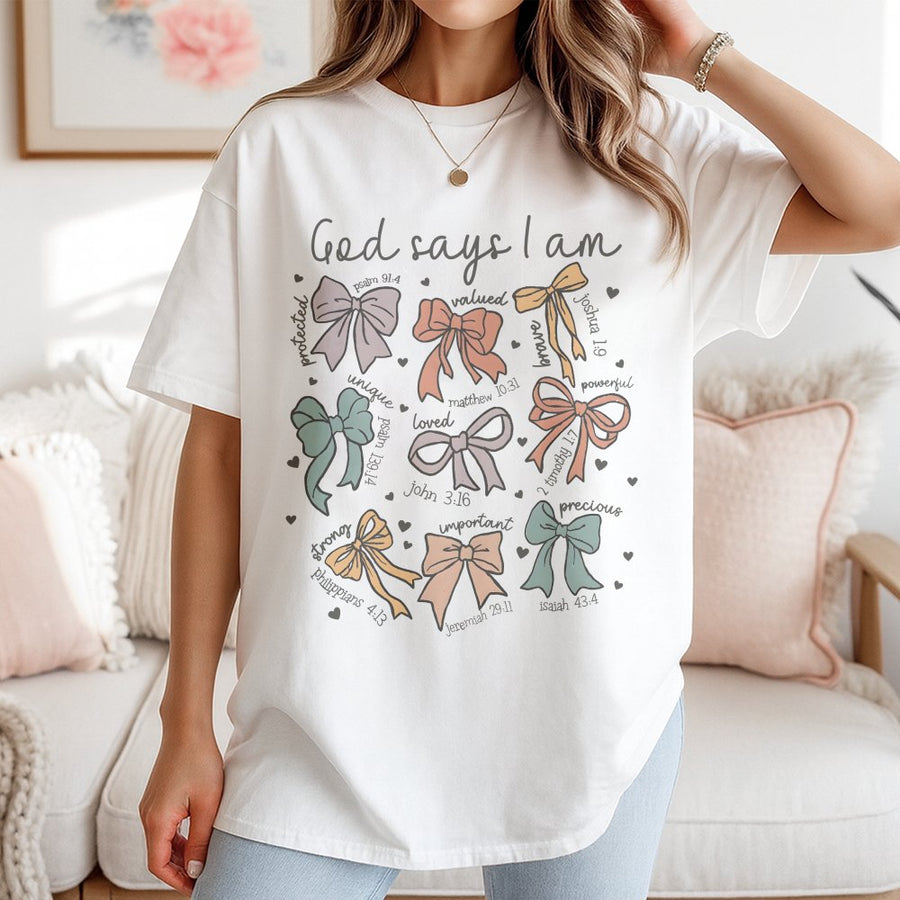 God Says I Am T-Shirt | Aesthetic Bow Bible Verse Graphic | Premium 100% Cotton Tee | Christian Faith Gift for Women & Teens