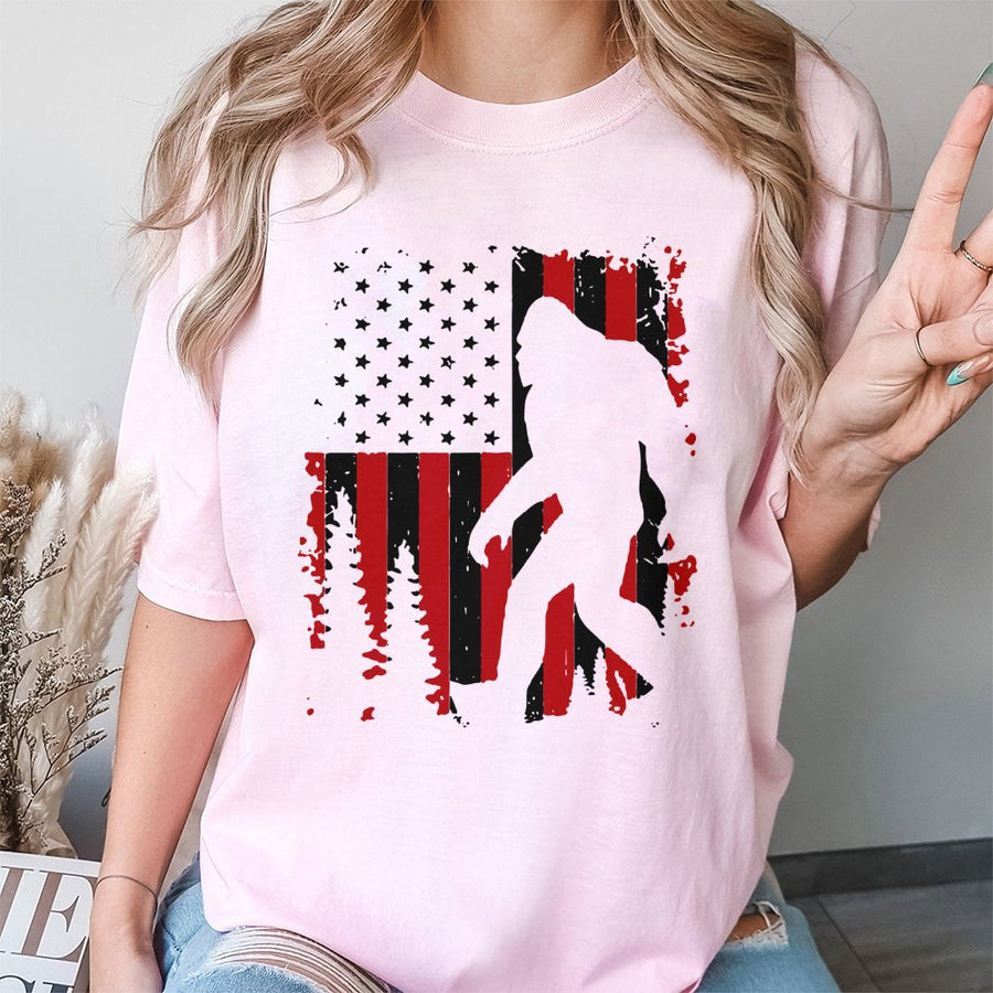 Bigfoot American Flag T-Shirt | Patriotic Sasquatch Forest Graphic | 100% Cotton Premium Tee | Unique Gift for Outdoor Lovers and Cryptozoology Fans