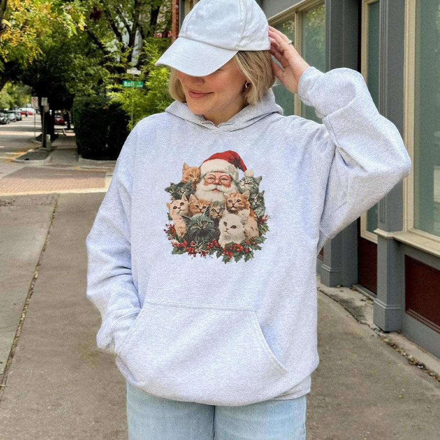 Santa Claus and Kittens Hoodie | Retro Christmas Cat Lover Graphic Sweatshirt | Premium Cotton-Blend | Holiday Gift for Women and Men