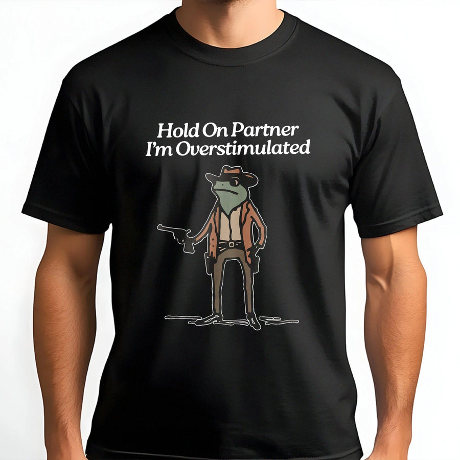 Hold On Partner I'm Overstimulated T-Shirt | Funny Cowboy Frog Graphic Tee | Premium 100% Cotton Apparel | Humorous Gift for Neurodivergent Friends