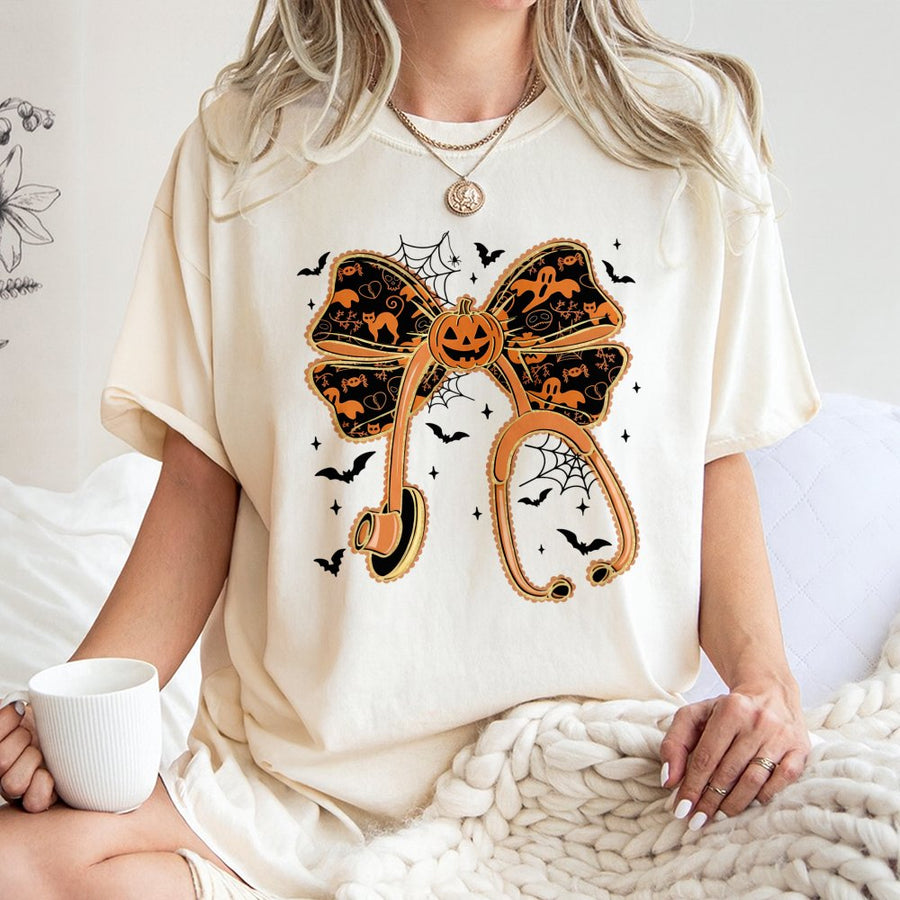 Halloween Nurse T-Shirt | Pumpkin Bow Stethoscope Graphic | Premium Soft Cotton | Spooky Gift for RNs and Healthcare Workers